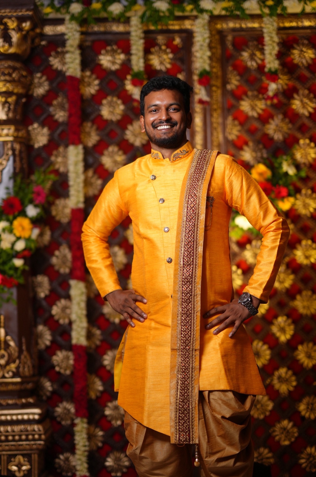 Sri, founder of SriFlash, smiling in traditional attire
